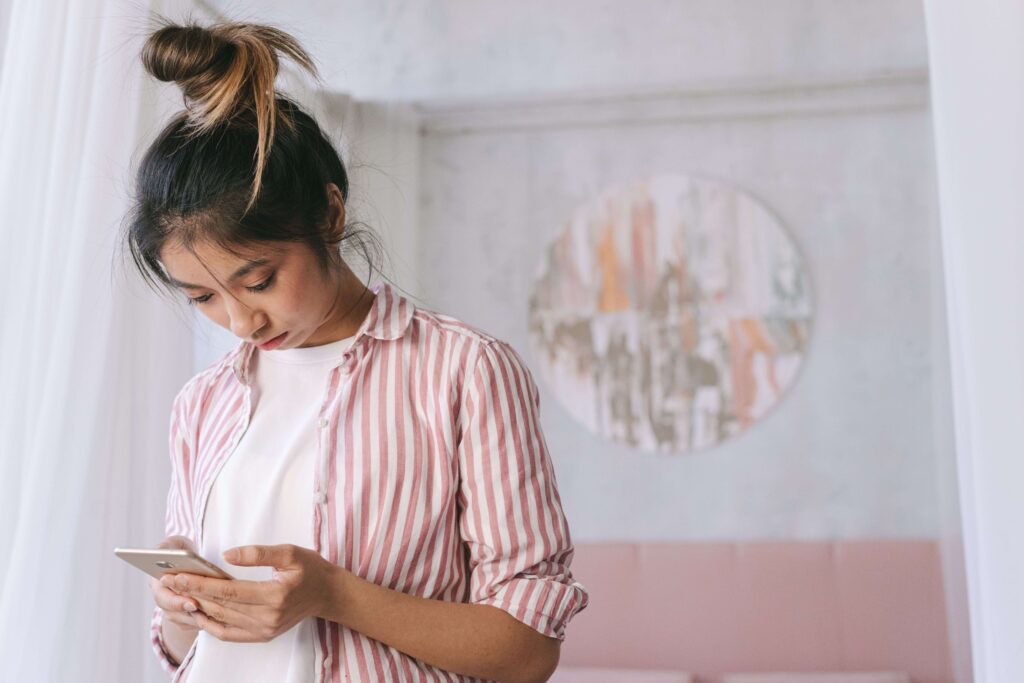 Anxious Thoughts - relationship uncertainty denver co - questioning your relationship denver co - individual relationship counseling denver co - colorado Person looking at a phone with concern, representing doubt and relationship uncertainty in Denver, CO.