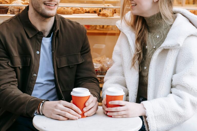 Couple getting coffee together and talking, representing open communication and emotional connection supported through communication in relationships in Denver, CO.