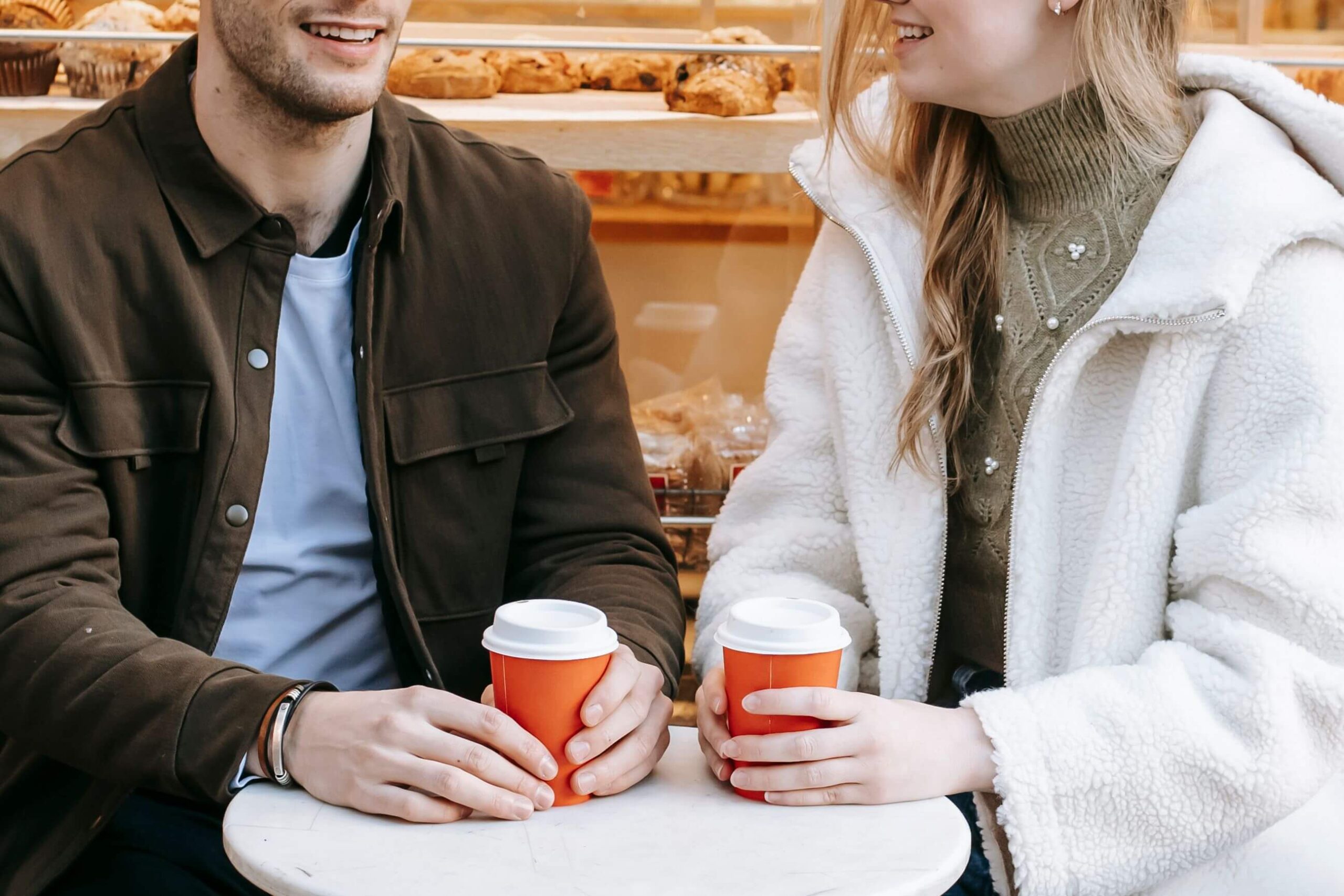 Open Conversation - communication in relationships denver co - individual relationship counseling denver co - individual relationship therapy denver co - colorado Couple getting coffee together and talking, representing open communication and emotional connection supported through communication in relationships in Denver, CO.