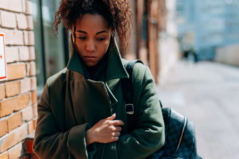Insecure person appearing uncertain, representing struggles with self-worth, accepting love, and attachment patterns addressed through individual relationship counseling in Denver, CO.