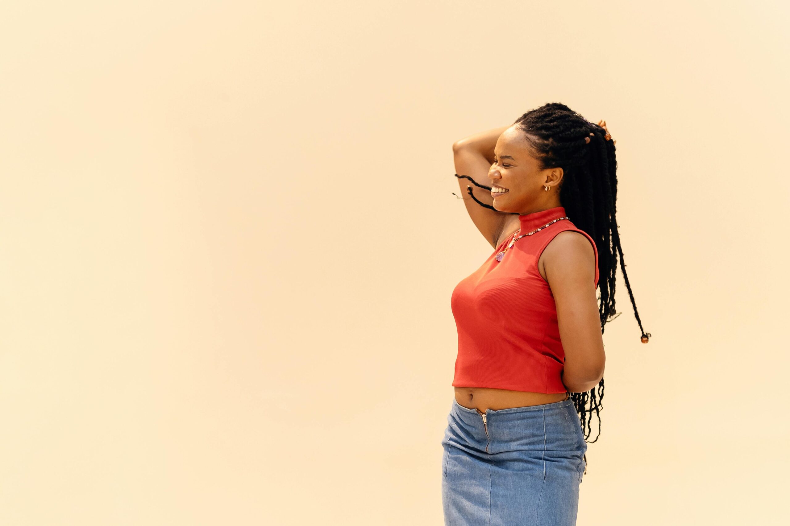Woman smiling, symbolizing confidence and emotional progress through individual relationship counseling in Denver, CO.